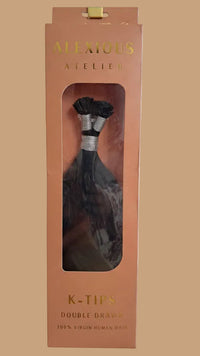 Package of ALEXIIOUS ATELIER K-TIPS hair extensions with a clear window showing the product.